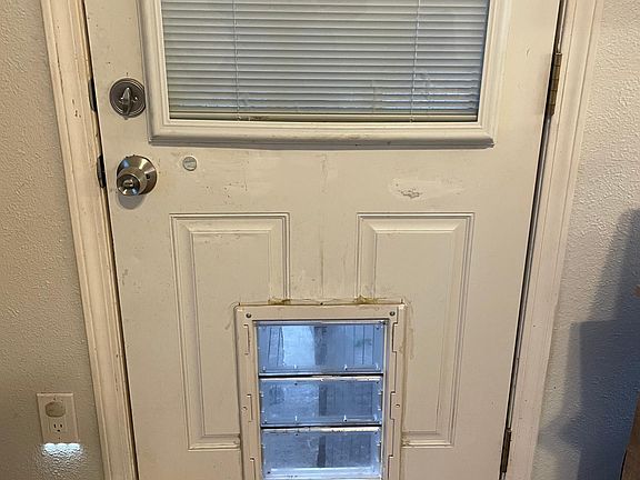 Dog Door to fenced in backyard