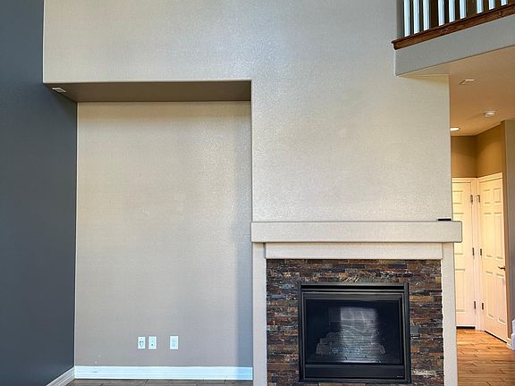 Family room with entertainment wall and fireplace