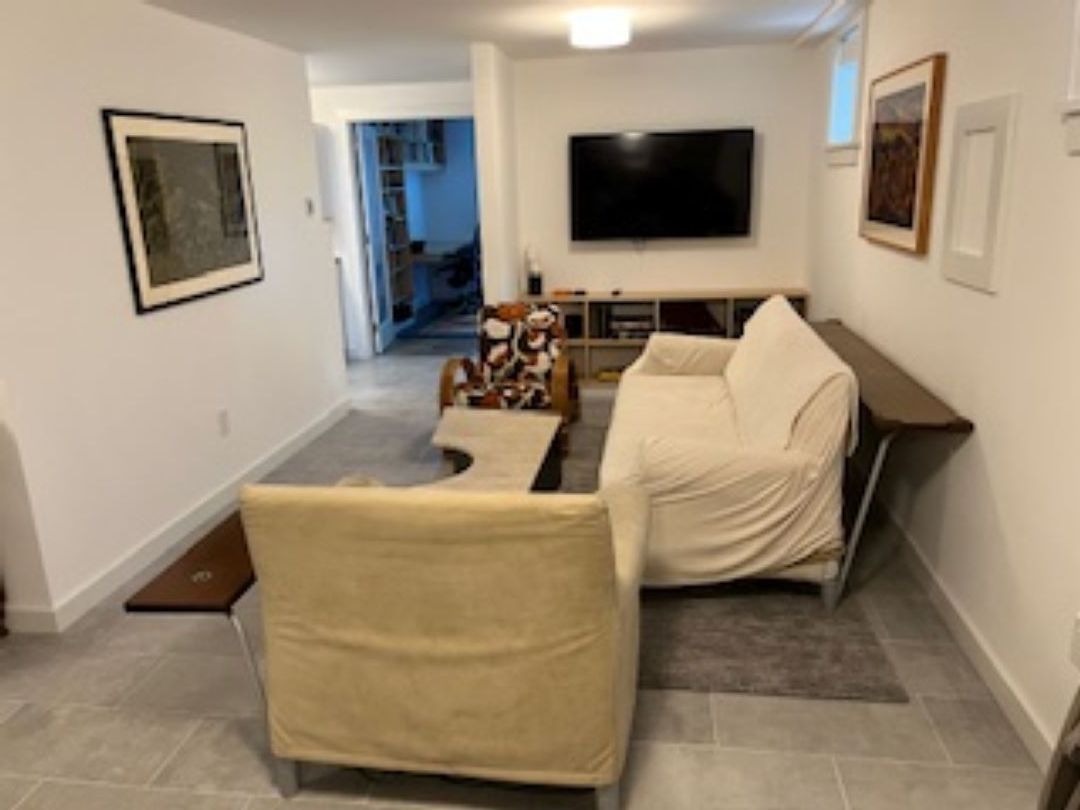 The lower level also features a kitchenette, living area and ping pong table.