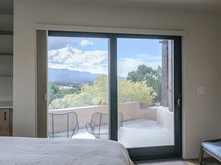 Guest room sliding door to private deck, view to the south