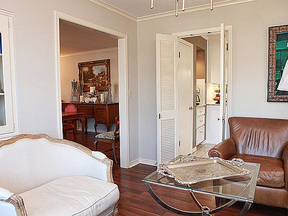 Another view of the living/dining shows the doorway leading to the dining/living!