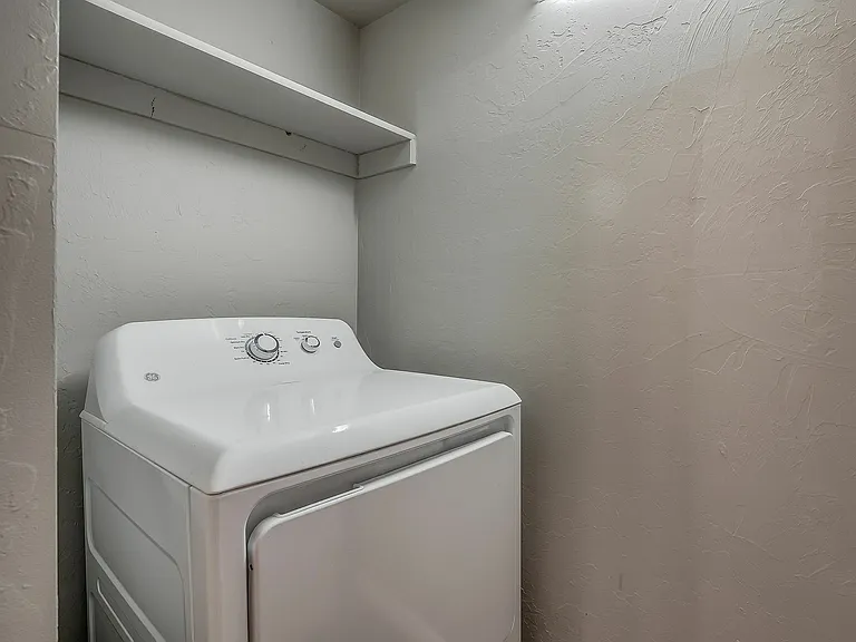 Maximize space with this efficient laundry nook, perfect for modern living.