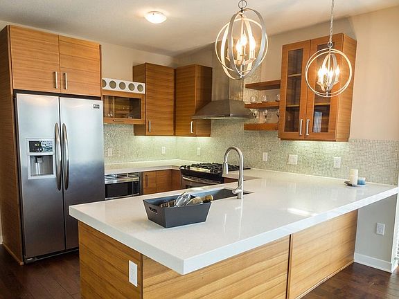 Teak Cabinets, Quartz Countertops, Cooktops, and more
