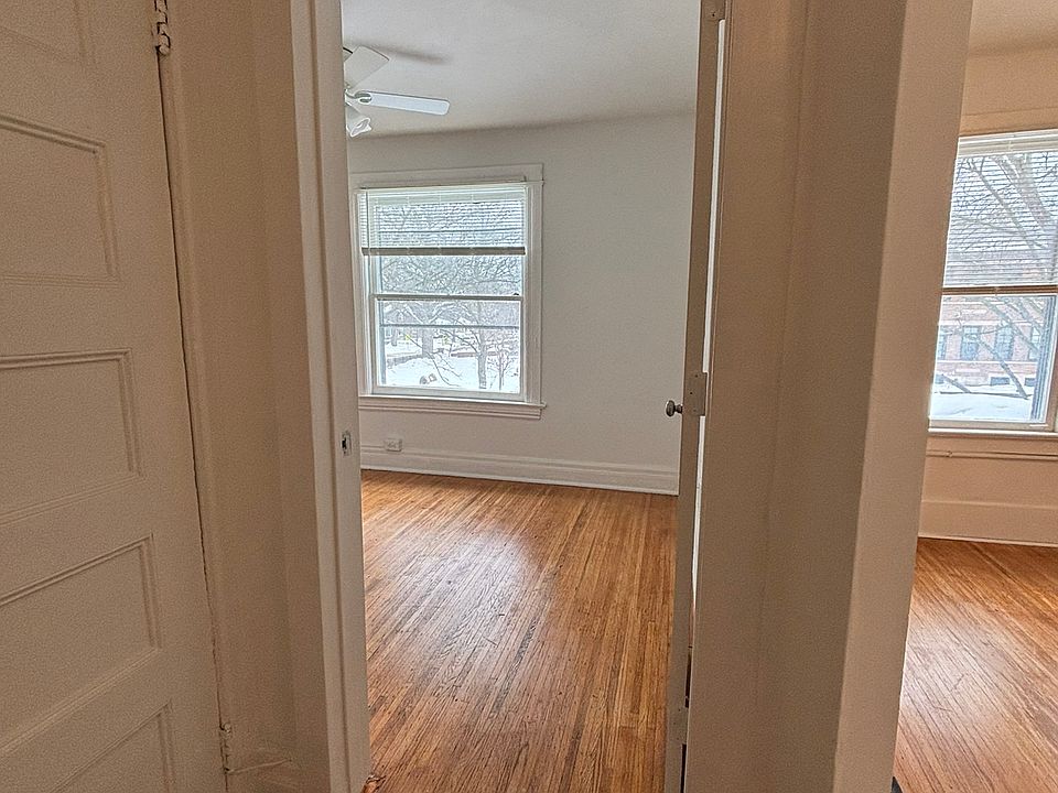 Bedroom 1 straight ahead. Living room through arch on the right. The door you see on the left is to your private unfinished walk-up attic for storage.
