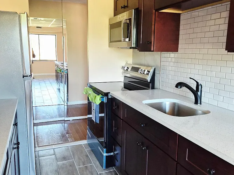BRAND NEW KITCHEN, CABINETS, STOVE, REFRIDGERATOR, MICROWAVE, BACK SPLASH, FLOOR