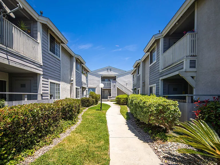 Walkway between buildings at the Presidio Villa Apartments in Vista, California.
