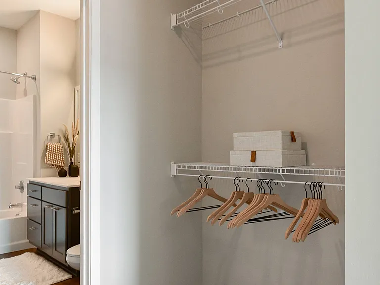 Walk-in closet with ample storage space at The Hallon luxury apartments in Hopkins, MN