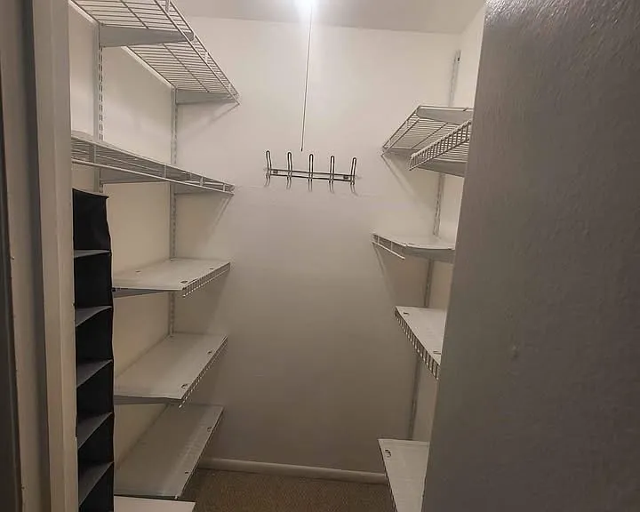 Walk in closet with shoe storage