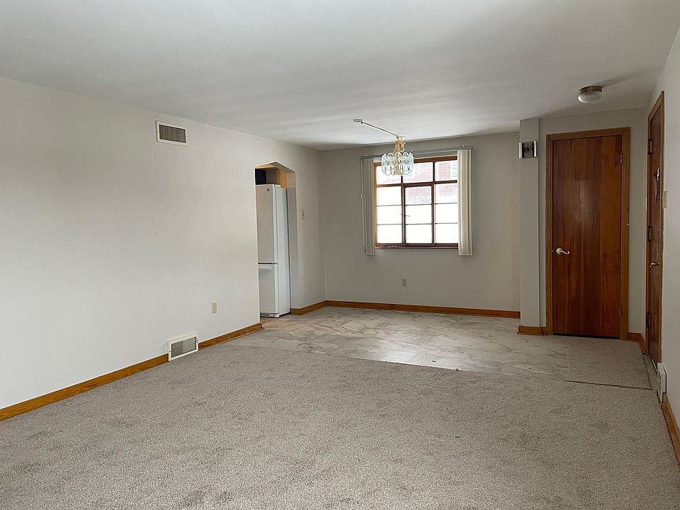 Living Room Dining Room. New paint and flooring throughout.