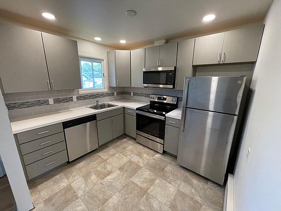 Your brand new kitchen. Dishwasher, disposal, stove top. oven and microwave and stainless refrigerator. New lighting, floors, cabinets and countertops