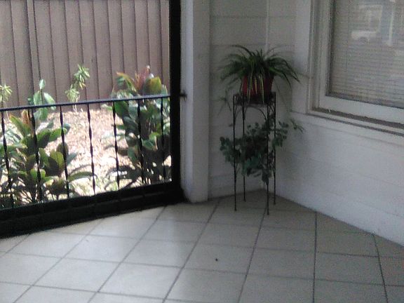 East side of porch next to driveway