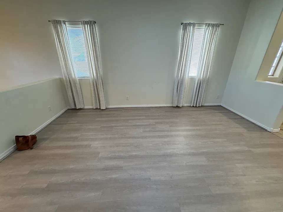 Spacious living area with natural lighting.