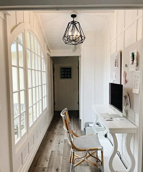 Hallway with double salon doors leading to back full 2nd bath, W/D and master bedroom/bathroom