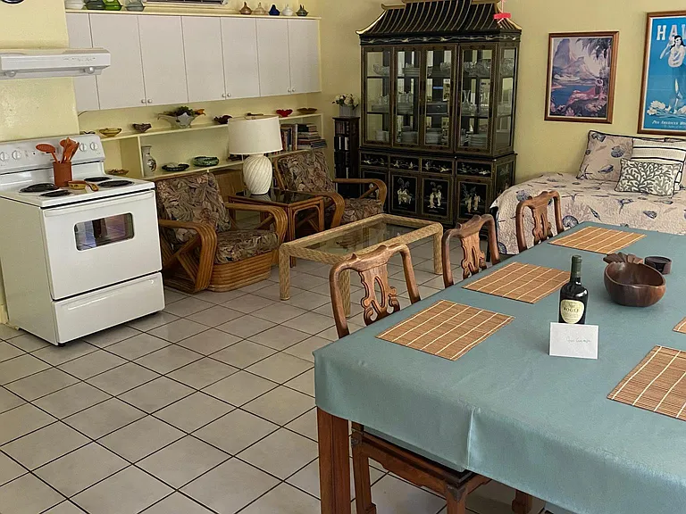 Kitchen area with dinning table, six chairs.