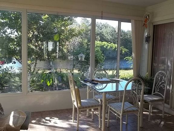 Sunroom w/ view of water