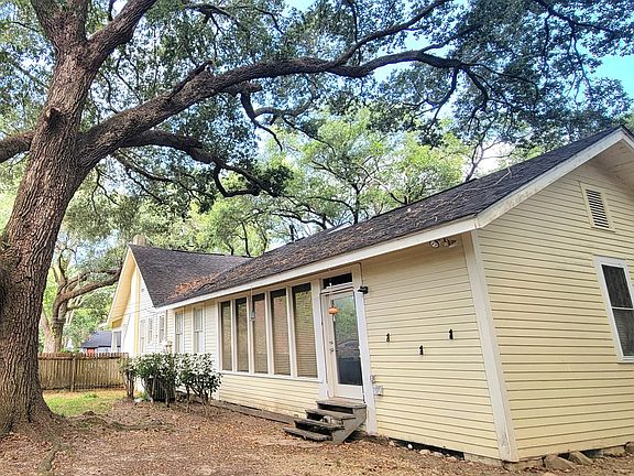 Fenced backyard with side door