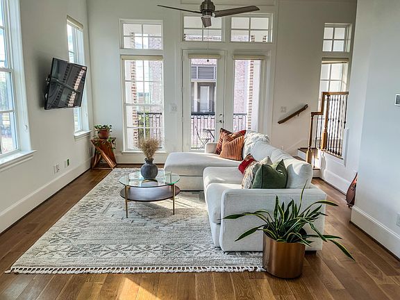 Custom Shangri-la window shades in the living room give you privacy while allowing natural light to shine through.