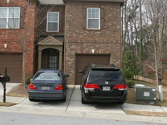 Front Elevation with 1 car garage and 2 parking spaces