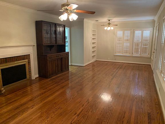 Large living room, working fireplace, beautiful shutters