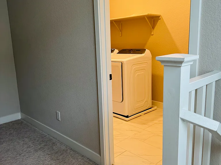 Washer/Dryer room next to stairs