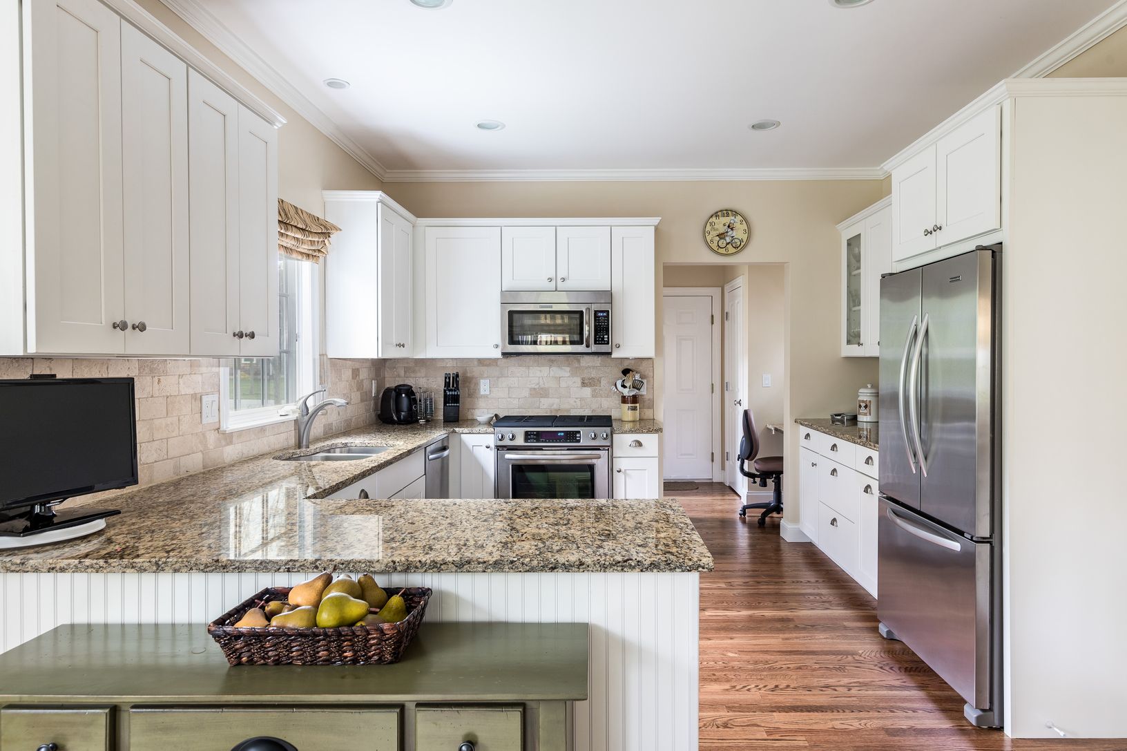  handsome kitchen w desk, leads to laundry