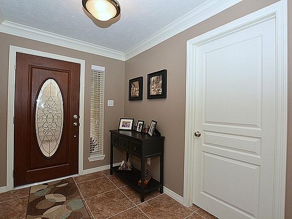 The spacious foyer is warm and inviting