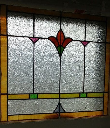 Beautiful Stained Glass windows in Front room. These & hardwood floors keep a classic Charm!