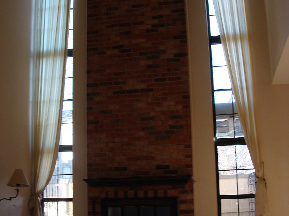 Living Room with vaulted ceiling and 15ft Windows