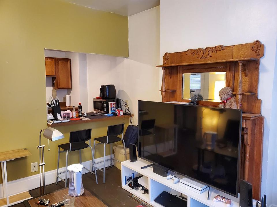 Living Room with original wooden fireplace mantle