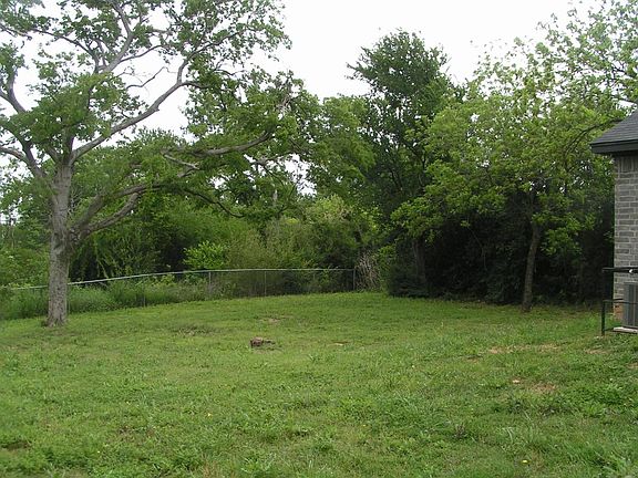 Huge backyard that is great for a bar-b-cue with a big famil