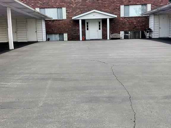 Front of building shows the storage area & the carport.