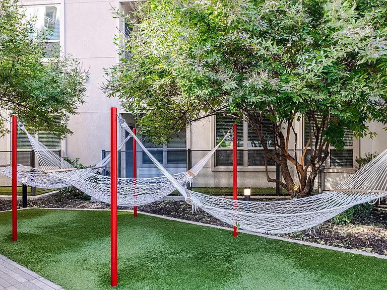 Outdoor Courtyard with Cabanas, Hammocks, and Peaceful Zen Garden
