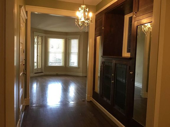 View into living room, built-in cabinets