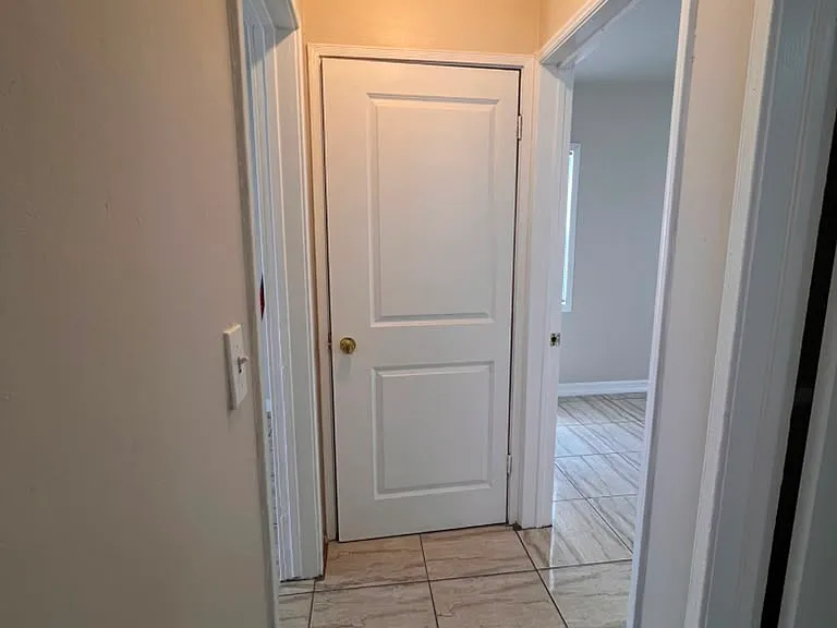 Hallway with small storage closet