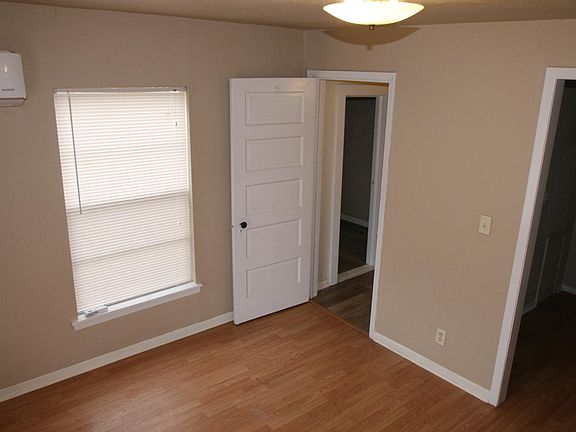 bedroom door leads to bathroom and storage room