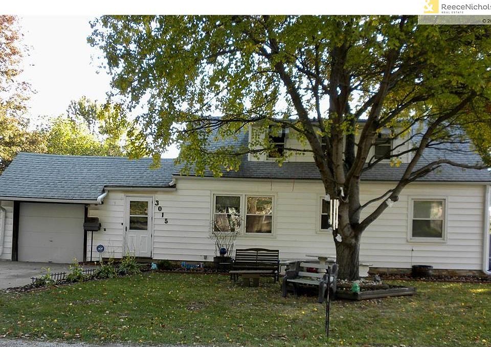3015 S 8th Street front - vinyl siding, newer windows, heated garage with work area.