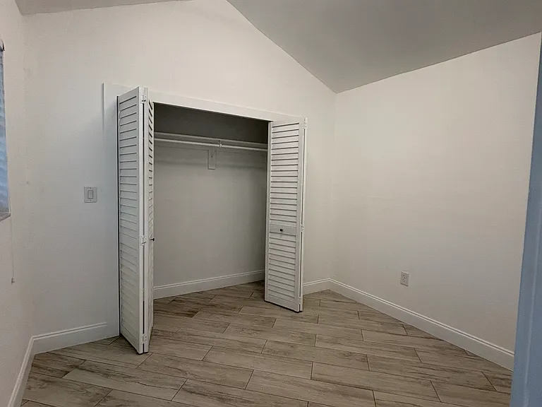 Bedroom with open closet