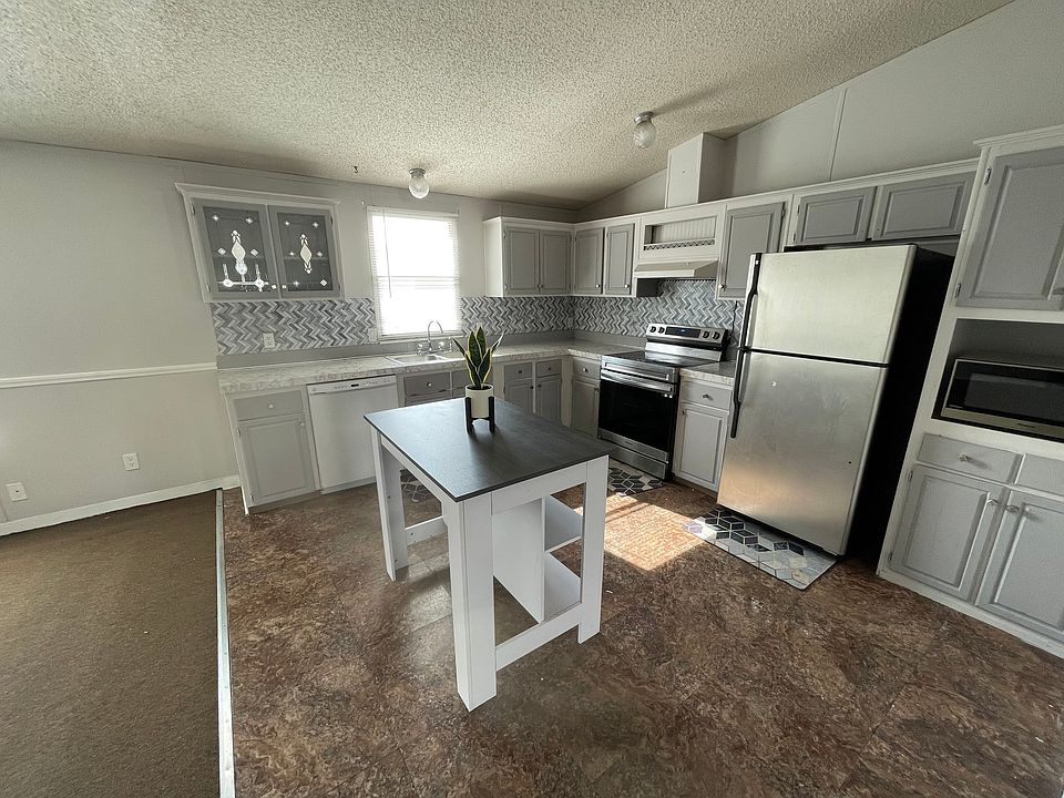 Spacious Kitchen with stainless steel appliances.
