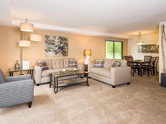Living Room/Dining Area Excellent space with sliding glass door viewing the forest!