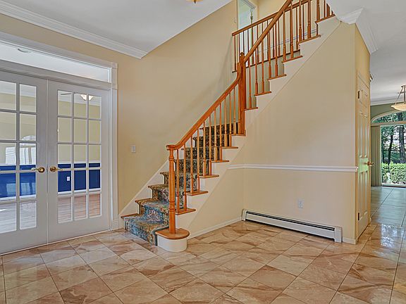 Large entry foyer with marble tile flooring