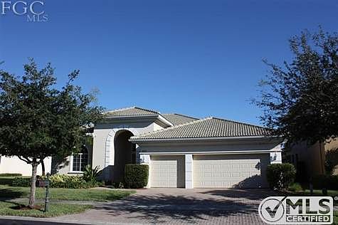 Quality construction with concrete block construction, tile roof and paver drive way.