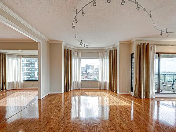 The living room , dinning room and the den. The whole area provides various options for arranging the furniture.