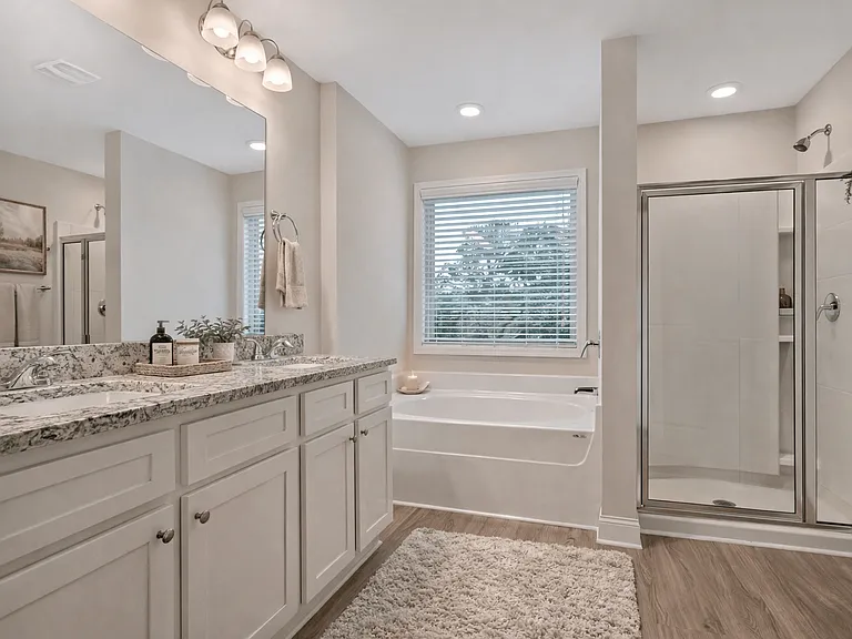 Elegant en suite with a double vanity off the primary bedroom.
