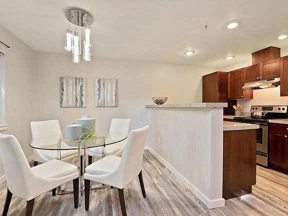 Updated flooring and designer lighting in the dining room.