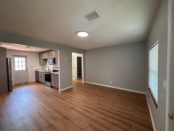 Enter to open concept living in fully updated home