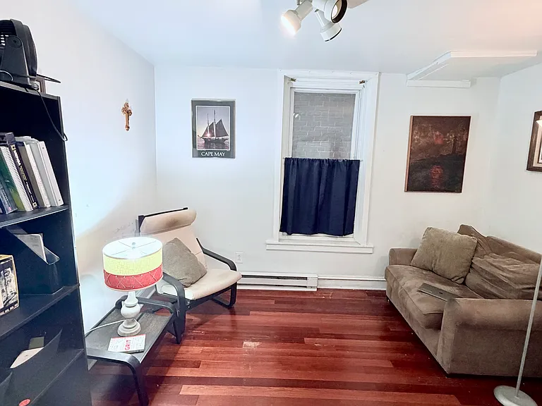 Larger bedroom with window and closet