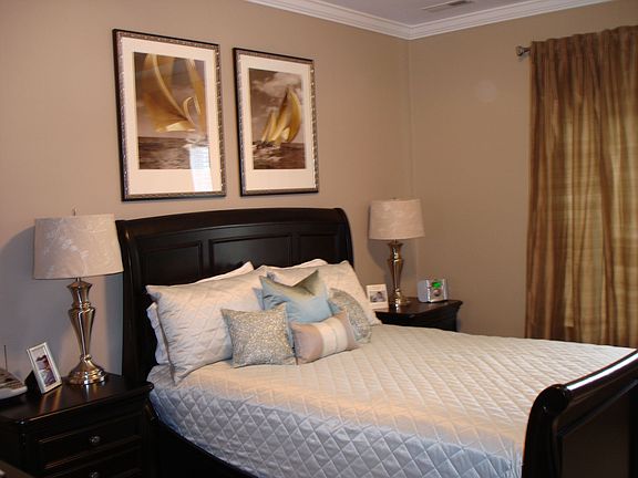 Master bedroom features double tray ceiling
