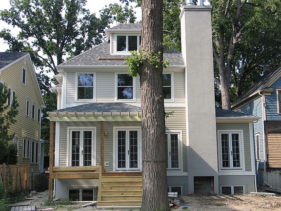 Back yard has patio w/fireplace