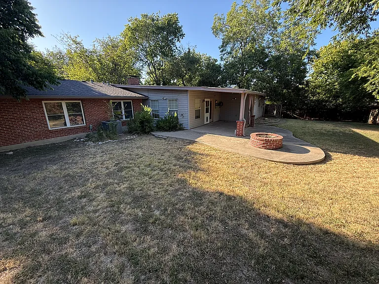 Backyard with fire pit and back patio