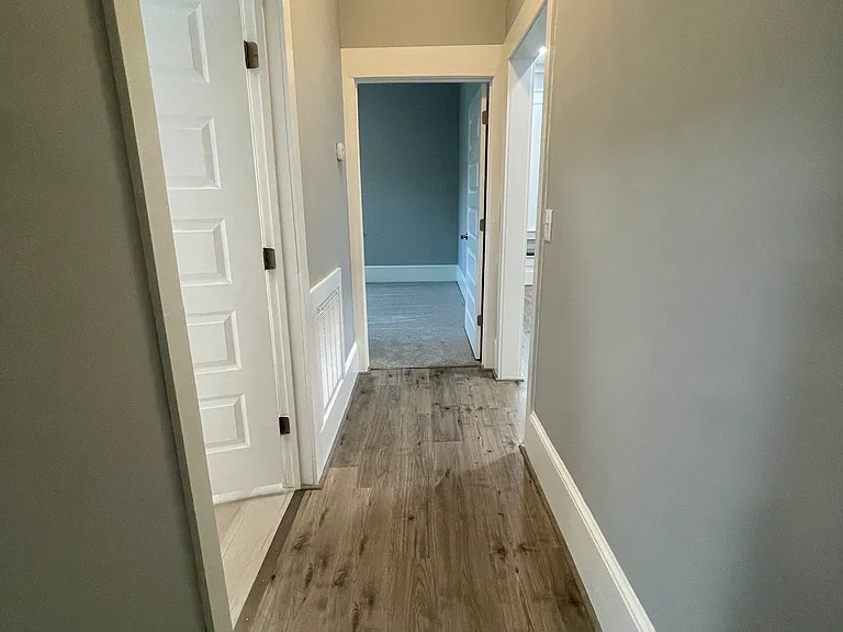 Hallway to bathroom and 2 bedrooms